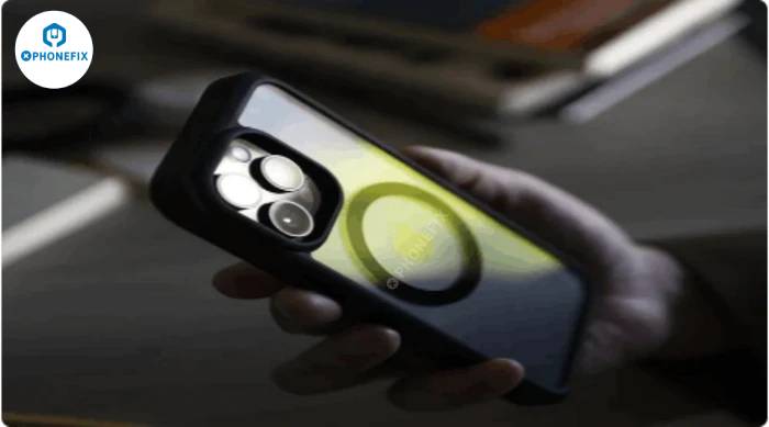 Person holding smartphone with rugged clear case and visible MagSafe ring, close-up