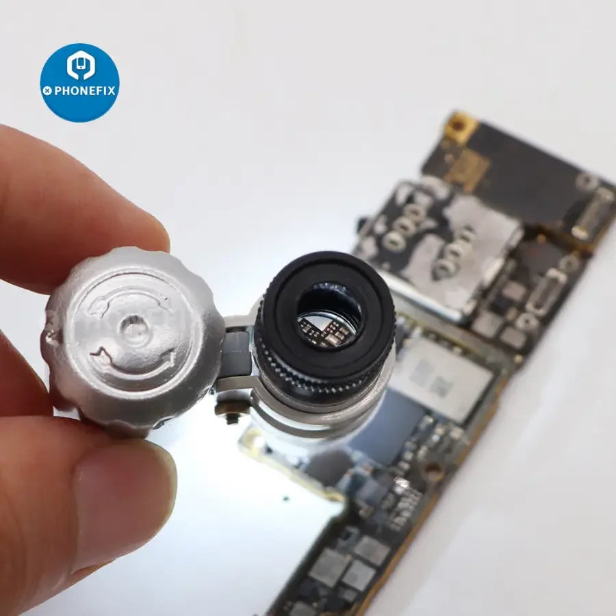 60x mini jeweler loupe by PHONEFIX with LED UV light, used for currency detection and detailed magnification of small objects.