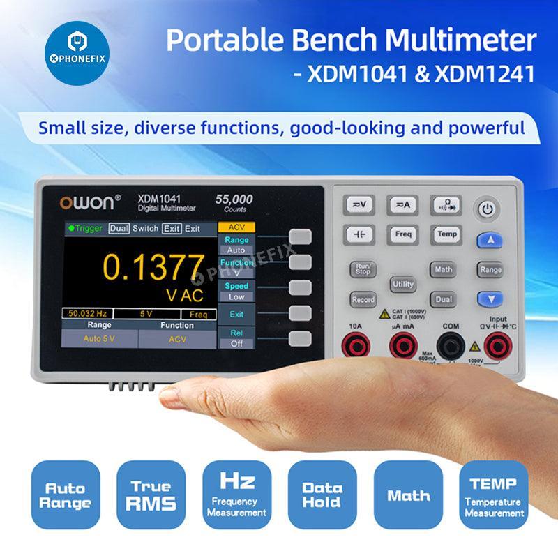 PhoneFix digital multimeter measuring AC and DC voltage and current, compact handheld tester for electrical testing.