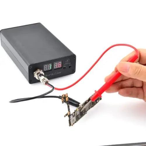 PHONEFIX Fonekong Shortkiller Box PCB soldering tool for short circuit testing and burning on electronic circuit boards.