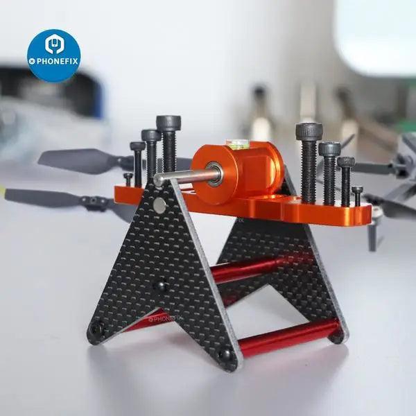 FPV multirotor propeller and prop balancer with level observer for RC drone repair, by PHONEFIX.