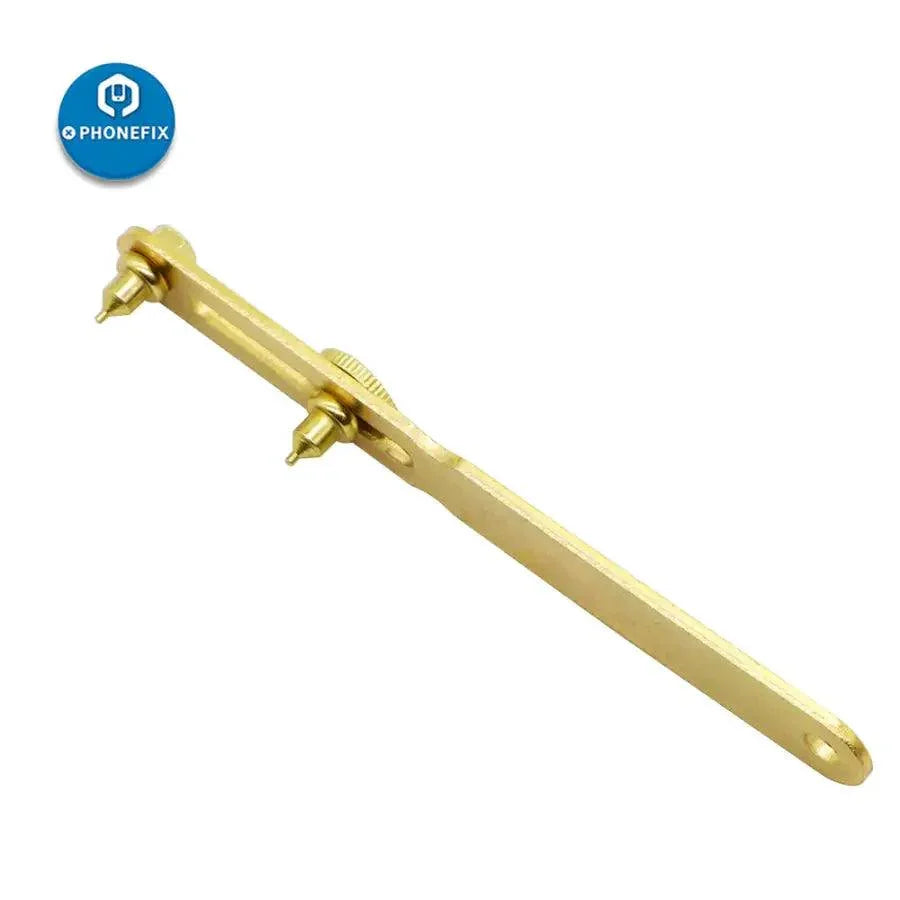 Gold two-claw screw watch back case opener tool by PHONEFIX for watch repair and watchmaker repair tasks.