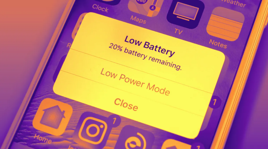 Mobile phone screen showing low battery warning with 20% remaining, app icons visible
