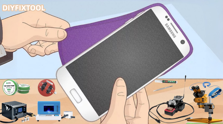 Person applying screen protector to Samsung smartphone with various phone repair tools on desk.