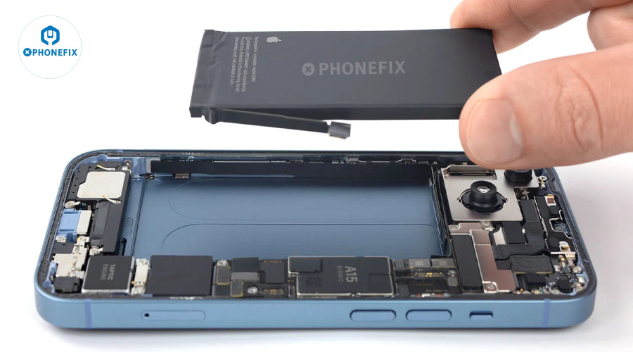 Hand removing smartphone battery above opened phone with visible internal components