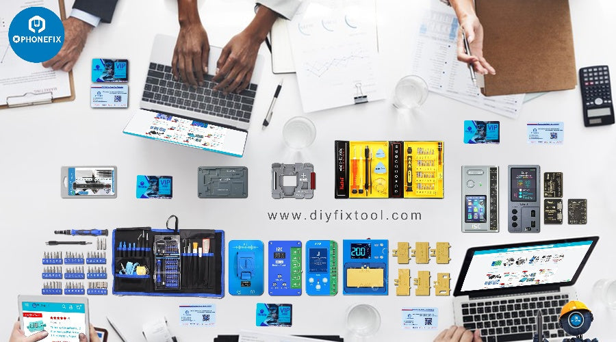 Mobile phone repair tool kits, components and accessories on desk with laptops and charts.
