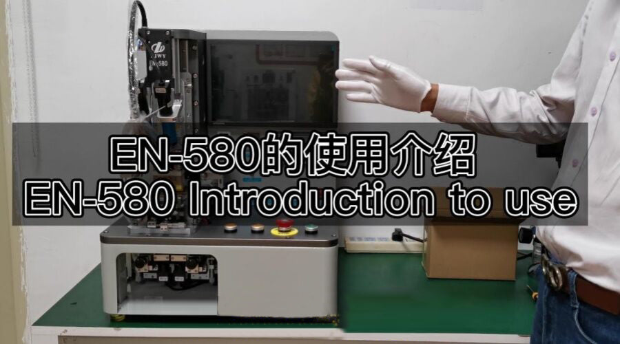 Person demonstrating EN-580 phone repair machine on workbench in electronics workshop