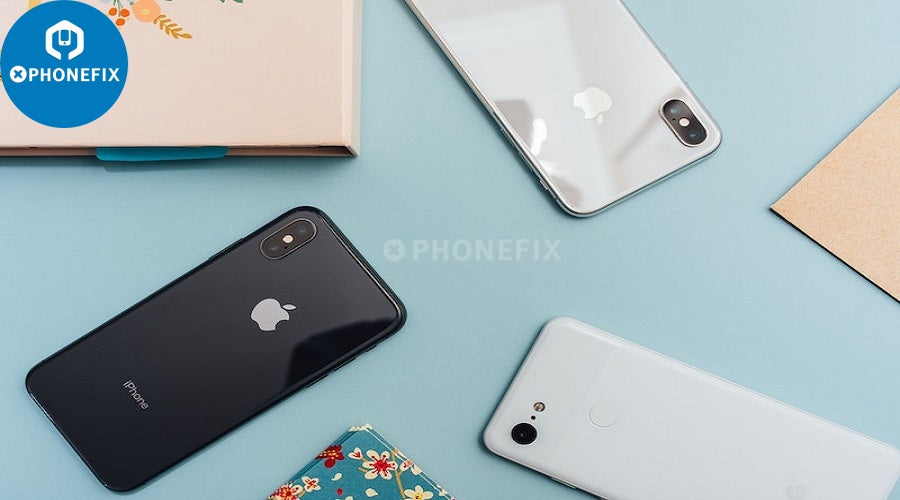 Three smartphones on a blue surface, showcasing phone repair parts and accessories.