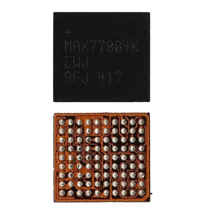 Close-up of PHONEFIX MAX77803 MAX77843 power management IC for Samsung Galaxy S4 I9500 Android phone, showing the chip on a circuit board.