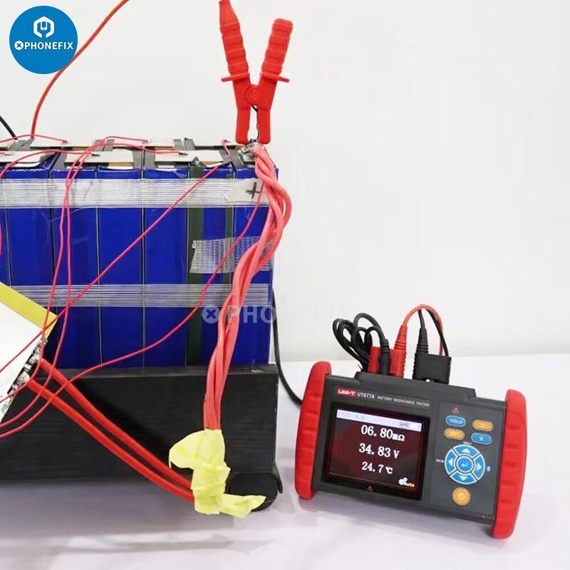 UNI-T UT677A battery resistance tester measuring voltage, resistance, and temperature for phone repair and diagnostics.