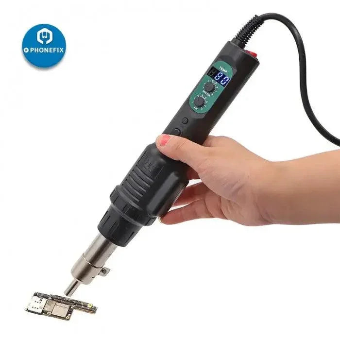 PHONEFIX DES 560B handheld hot air gun for BGA rework and digital de-soldering, shown in use for electronics repair.
