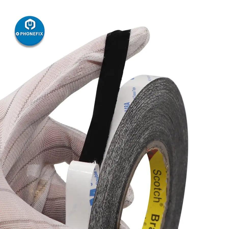 Black double-sided adhesive tape for phone touch screen repair, made by PHONEFIX, used as a consumable for device fixing.