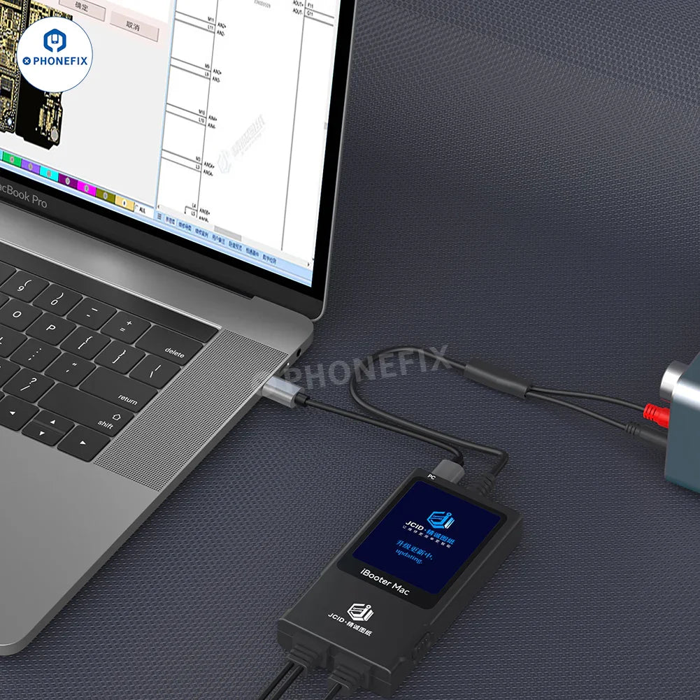 PHONEFIX JCID Drawing iBooter Mac current analyzer connected to MacBook DC power cable, used for MacBook repair diagnostics