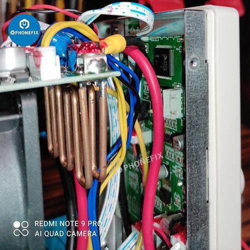 UNI-T DC electronic load power supply used for testing phone battery current, branded PHONEFIX, with digital display and control buttons.