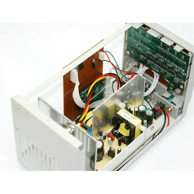 PhoneFix DPS-305 adjustable DC power supply showing LED display with 0-30V and 0-5A output, compact electronic testing equipment.
