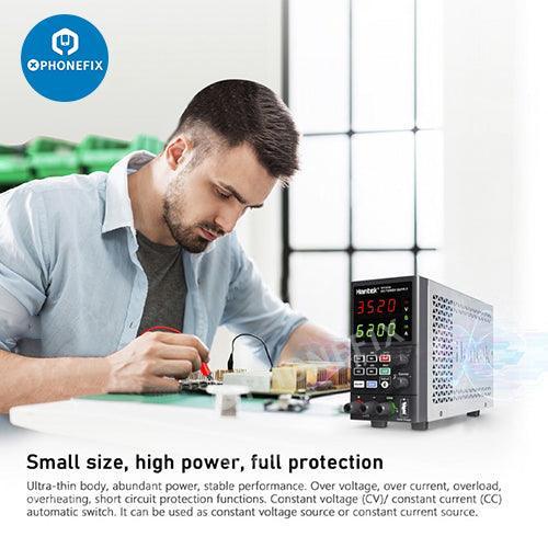 Alimentation CC numérique réglable de PHONEFIX pour la réparation de téléphones, avec affichage des commandes à l'écran et des ports de connexion.