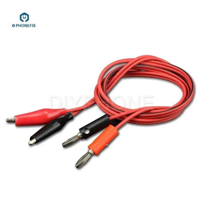 PhoneFix DC power supply cable with alligator clips and banana plugs for digital multimeter testing, shown with clips connected to the cable.
