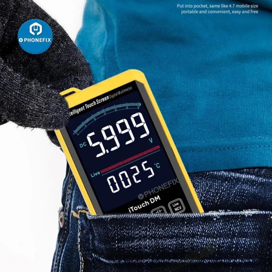 PhoneFix MECHANIC iTouch DM digital multimeter displaying voltage and current readings on a digital screen.