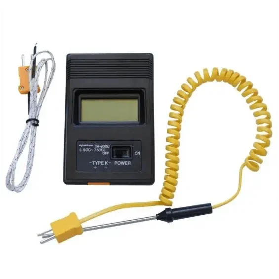 PHONEFIX TM-902c digital multimeter with temperature measurement, showing its LCD display and handheld design for precise readings.