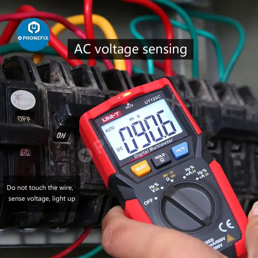 PhoneFix UNI-T UT125C mini digital multimeter showing capacitance and resistance readings on its screen.