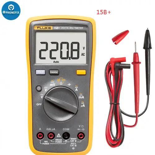 Fluke 15B+, 17B+, 18B+ digital multimeter and voltage frequency tester by PHONEFIX, showing display and measurement probes.