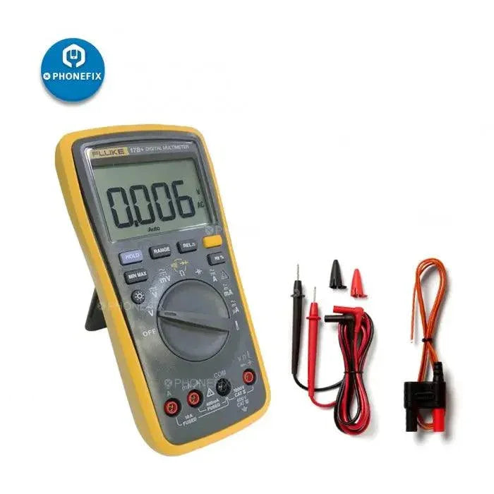 Fluke 15B+ 17B+ 18B+ digital multimeter with voltage and frequency tester, branded by PHONEFIX, shown in use.