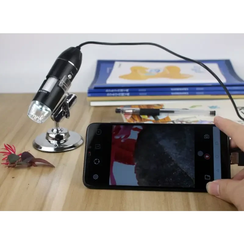 USB digital microscope endoscope with 1000X-1600X magnification from PHONEFIX, showing close-up view of tiny objects.