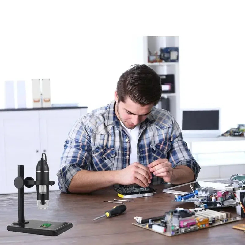 USB digital microscope endoscope by PHONEFIX showing close-up view with 1000X to 1600X magnification, electric microscope for detailed inspection