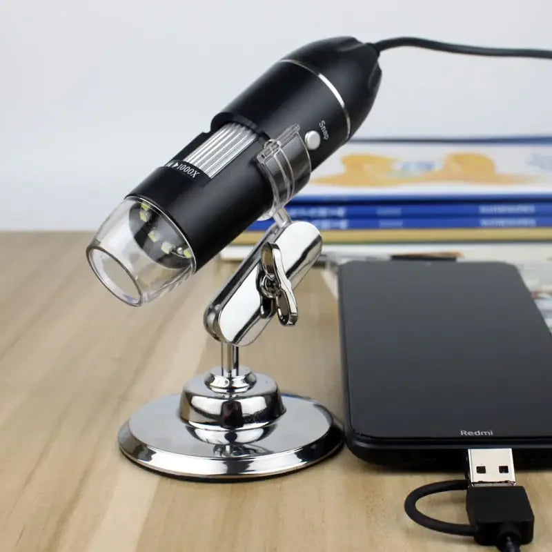 Electric USB digital microscope by PHONEFIX showing 1000X to 1600X magnification with a viewing endoscope and magnifier lens.