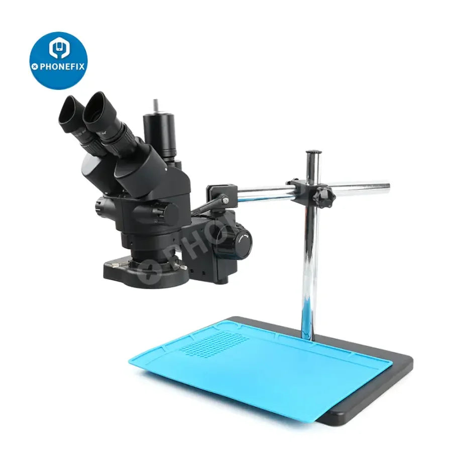 PHONEFIX 3.5X-90X trinocular stereo microscope with 144 LED light and mat for soldering, used for detailed electronic work.