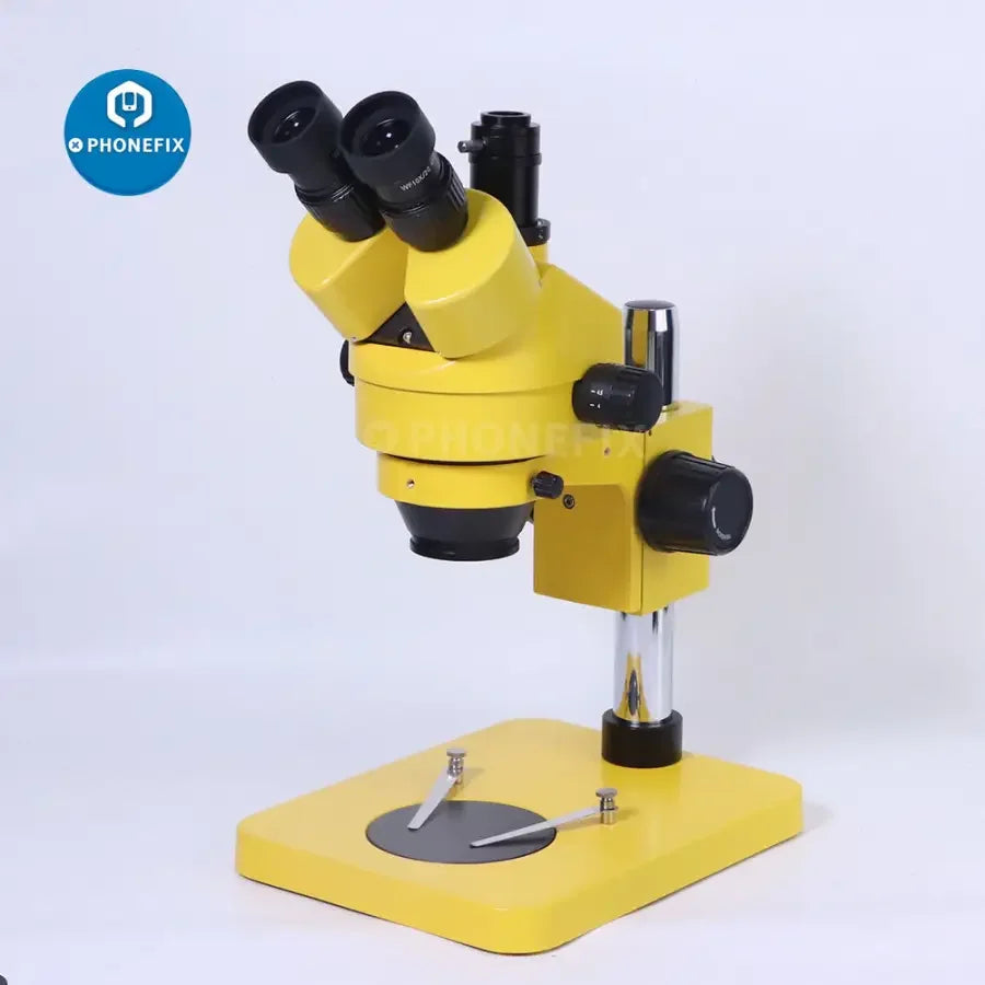 Yellow 7x-45x trinocular stereo zoom microscope for phone PCB repair, featuring adjustable magnification and ergonomic design by PHONEFIX.