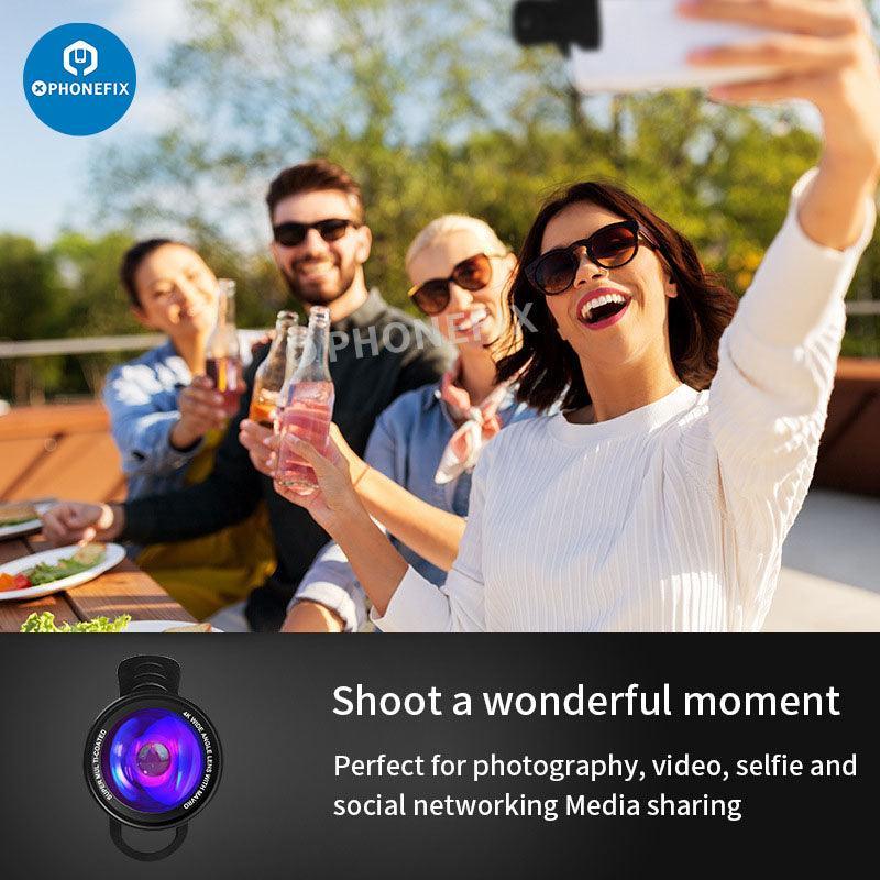 PhoneFix 2-in-1 4K HD wide-angle and macro lens with LED lamp attached to a smartphone camera for enhanced photography.