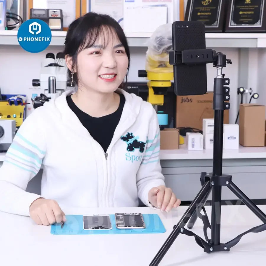 PhoneFix industrial camera tripod and selfie stick, 85.5cm adjustable stand with phone holder for live streaming and photography.