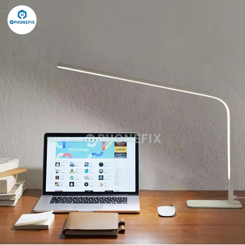 Lámpara de escritorio LED inteligente PHONEFIX de 12 W con lupa, brillo ajustable y tres opciones de color para una iluminación focalizada.
