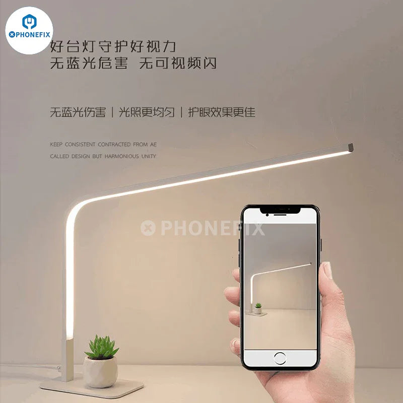 Lámpara de escritorio LED inteligente PHONEFIX de 12 W con lupa, iluminación de tres colores y brillo ajustable para un trabajo que requiere concentración.