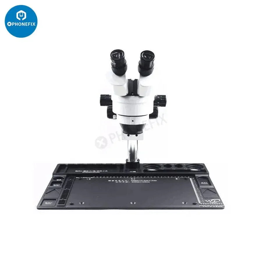 Red aluminum alloy microscope fixed base pad for PCB soldering repair, featuring detailed surface for electronics work.