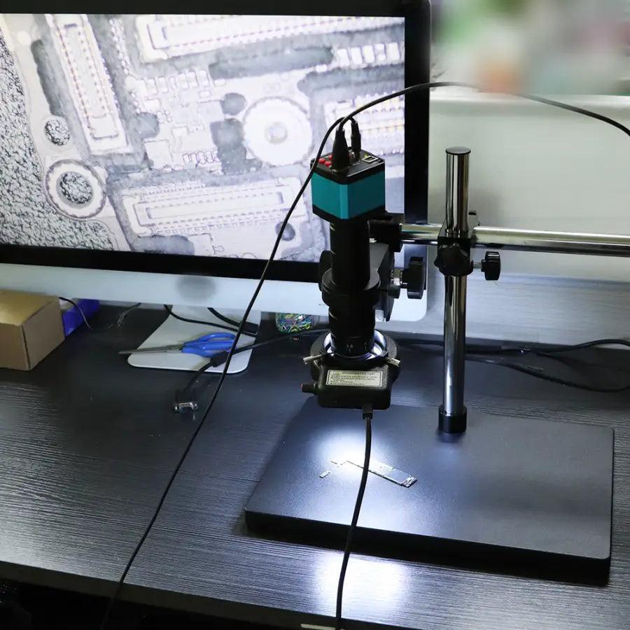 PHONEFIX 38MP HDMI USB digital video microscope camera for PCB soldering, showing close-up view of circuit board inspection.