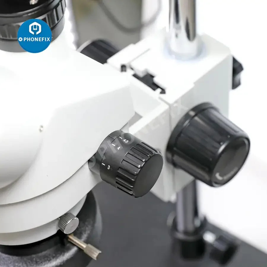 PHONEFIX 7-45x SZM45T-B1 industrial stereo trinocular microscope with built-in light, featuring adjustable magnification and viewing head.
