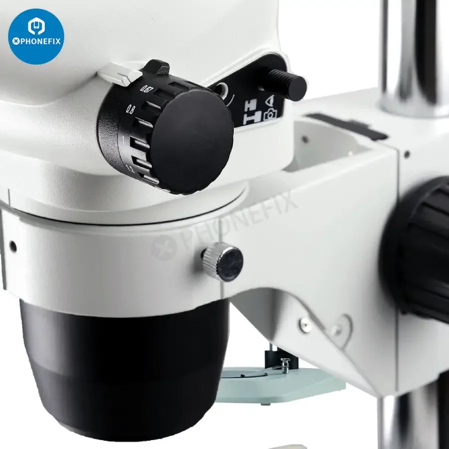 SZN71 Zoom Stereo Trinocular Microscope by PHONEFIX with adjustable zoom and binocular eyepieces for detailed viewing.
