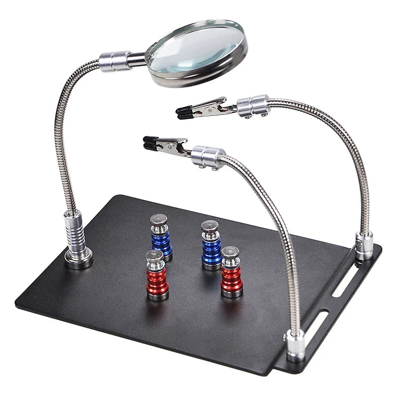 PhoneFix motherboard test fixture with soldering iron station stand, welding magnifying glass clip for precise electronics work.