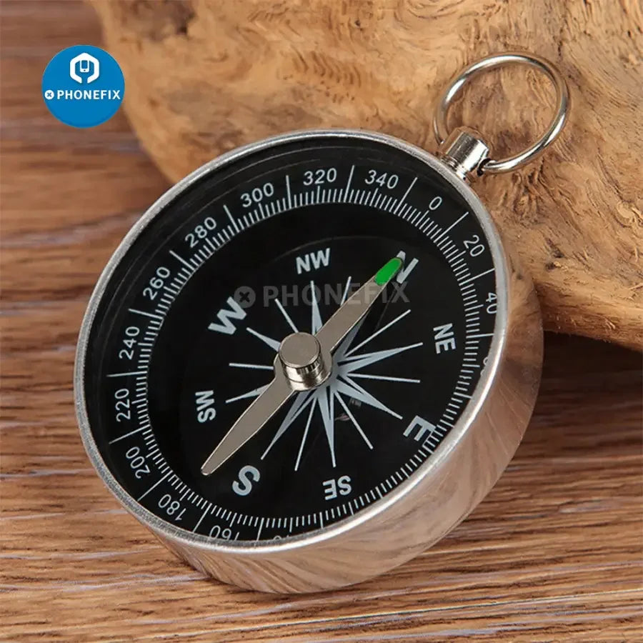 Portable lightweight emergency compass by PHONEFIX, outdoor navigation tool for wilderness survival and outdoor adventures.