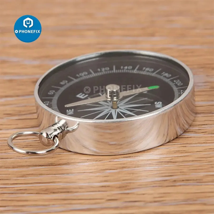 Portable lightweight emergency compass by PHONEFIX for outdoor navigation and wilderness survival.