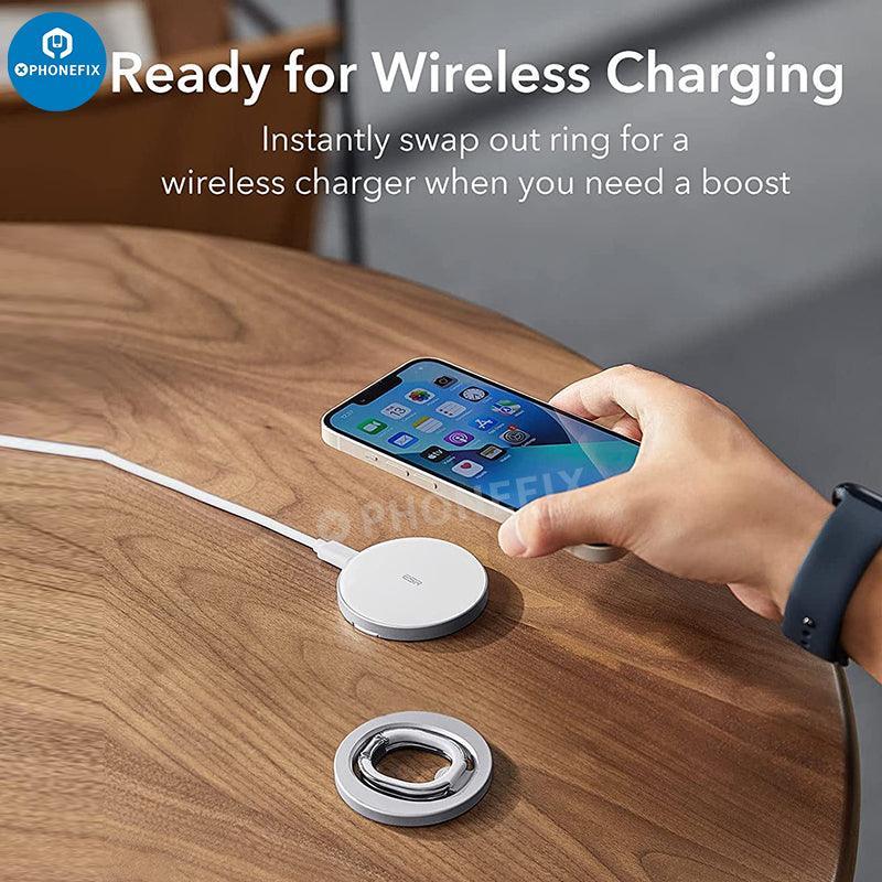 Black MagSafe magnetic ring holder with adjustable stand for iPhone 12-14, by PHONEFIX, shown with the phone accessory in use.