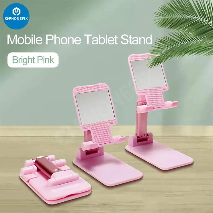 Foldable PHONEFIX aluminum alloy tablet and phone holder stand on a desktop, showcasing its compact, adjustable design.