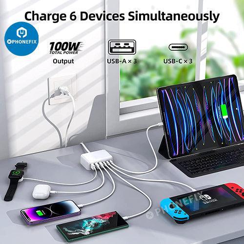 PHONEFIX 6-in-1 USB-C fast charging station with multiple ports for charging phones and tablets, shown with connected devices.