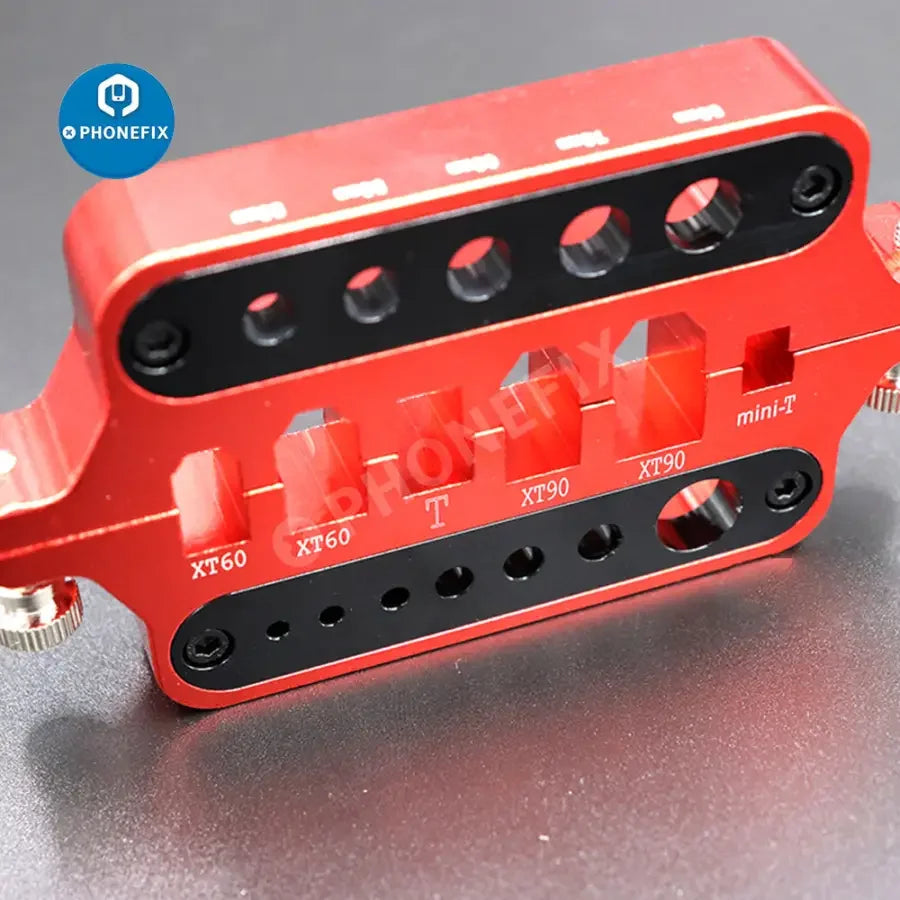 Red PHONEFIX multi-function XT60/90 T plug connector soldering tool holder for RC car and drone repair tools.