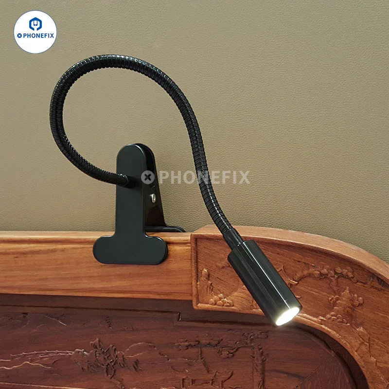 Ring light LED desk lamp by PHONEFIX with dimmable eye care features, USB clamp mount for reading and workspace illumination.