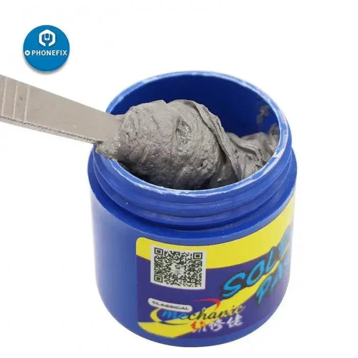 PhoneFix mechanic soldering tin paste at 158°C for CPU rework, showing the welding cream applied to electronic components.