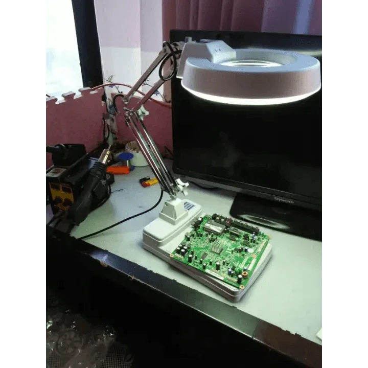 PHONEFIX 20x desktop soldering magnifying glass with LED light and adjustable bracket for detailed electronic work.