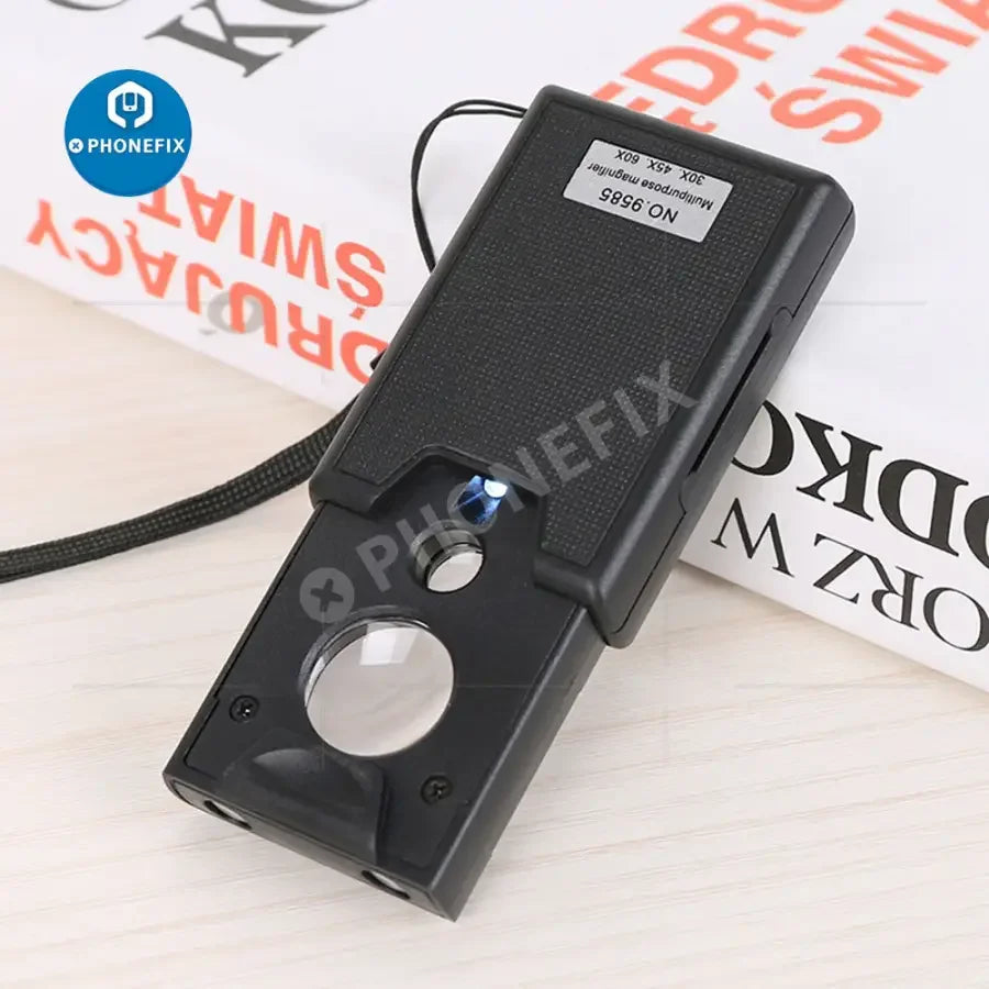 Portable PHONEFIX soldering magnifying glass with 30x to 60x zoom, ideal for jewelry inspection and detailed viewing.